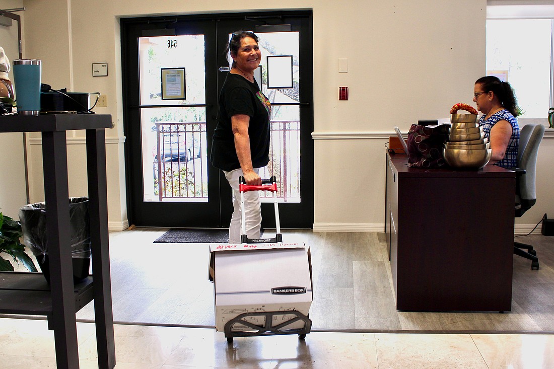 Amy Steinhauser, executive director of The Paradise Center, leads the effort to pack up materials from the community center in anticipation of the move to Longboat Island Chapel.