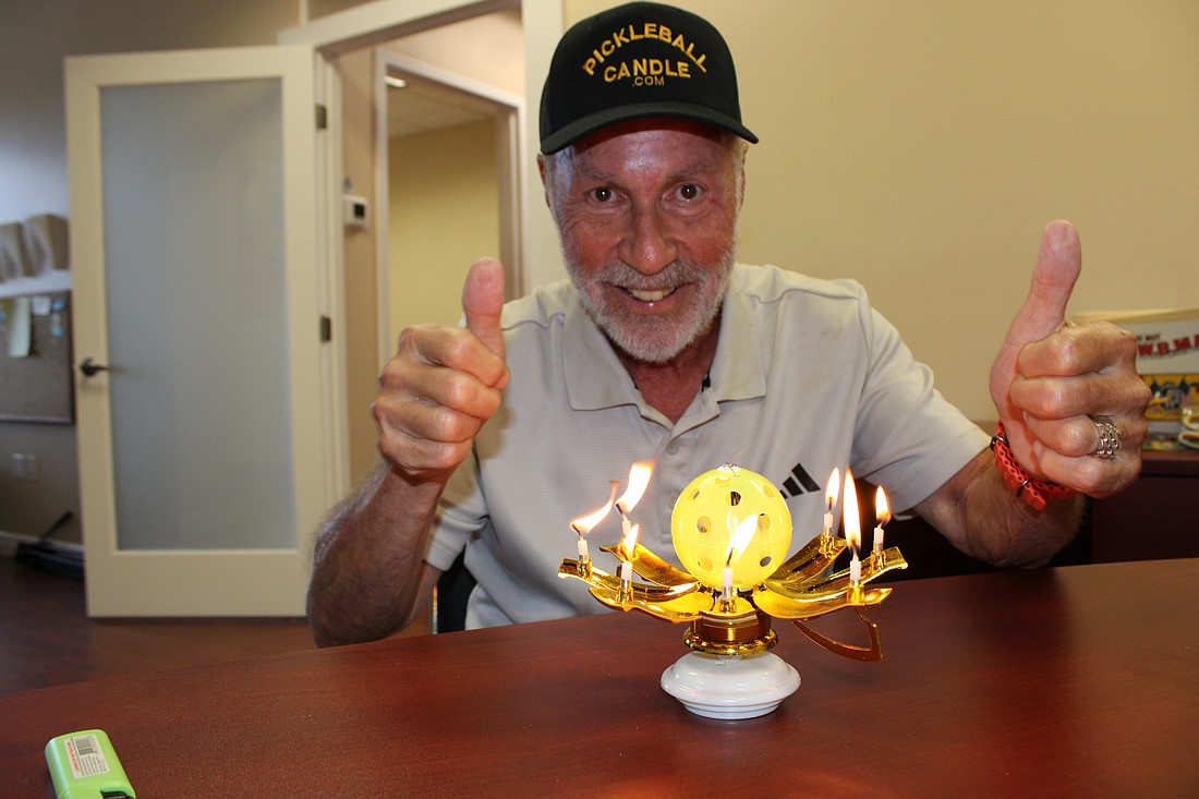 When Stanley Brown's Pickleball Musical Birthday Candle is lit, its sides spin and drop to reveal a pickleball and candles.