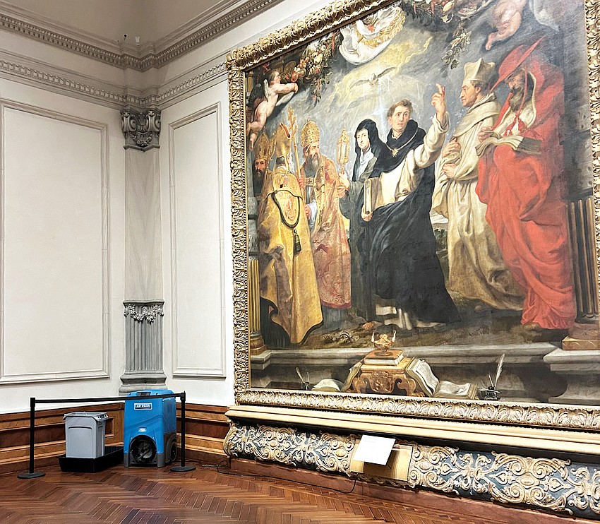 Garbage receptacles to catch roof leaks as well as dehumidifiers are stationed in the Rubens Gallery at the Ringling Museum.